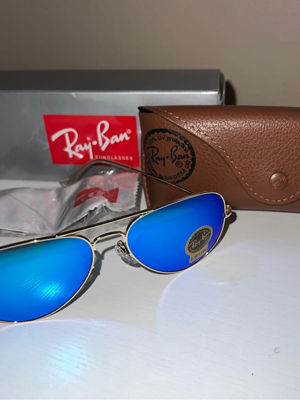 Ray-Ban Gold Frame Sunglasses with Blue Mirrored Lenses